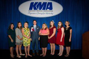 Shawn Jones, M.D., fourth from left, a Paducah otolaryngologist who was presented with the KMA Distinguished Service Award Saturday night, complimented the Middlesboro students who worked to get a smoking ban passed and were recognized with the KMA Debra K. Best Outstanding Layperson Award. Pictured with Dr. Jones are teachers Tonya Martin, left, and Kelsey Massengill, right, and students Haylee Mills, Chloe Burchett, Ryann Tong, Sabrina Sparks and Kaylea Martin. Photo by David Knapp for KMA.