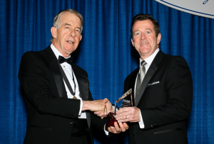 2015-16 KMA President Ted Miller, M.D., PhD, presented Shawn Jones, M.D., of Paducah with the Distinguished Service Award during the Leadership Dinner at the KMA Annual Meeting. Jones was also recognized as as KMA Community Connector. Photo by David Knapp for KMA.
