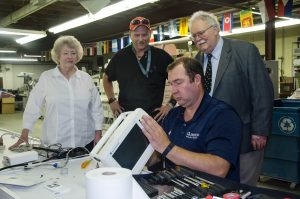  Melissa Mershon, president and CEO of Supplies Over Seas, left, is pictured with Courtney Nanny, Gordon Tobin, M.D., and Mike Robinson at Supplies Over Seas. KMA’s Kentucky Foundation for Medical Care provided a grant for testing equipment for the Medical Surplus Recovery Organization to ensure donated medical equipment is usable by organizations receiving the equipment.